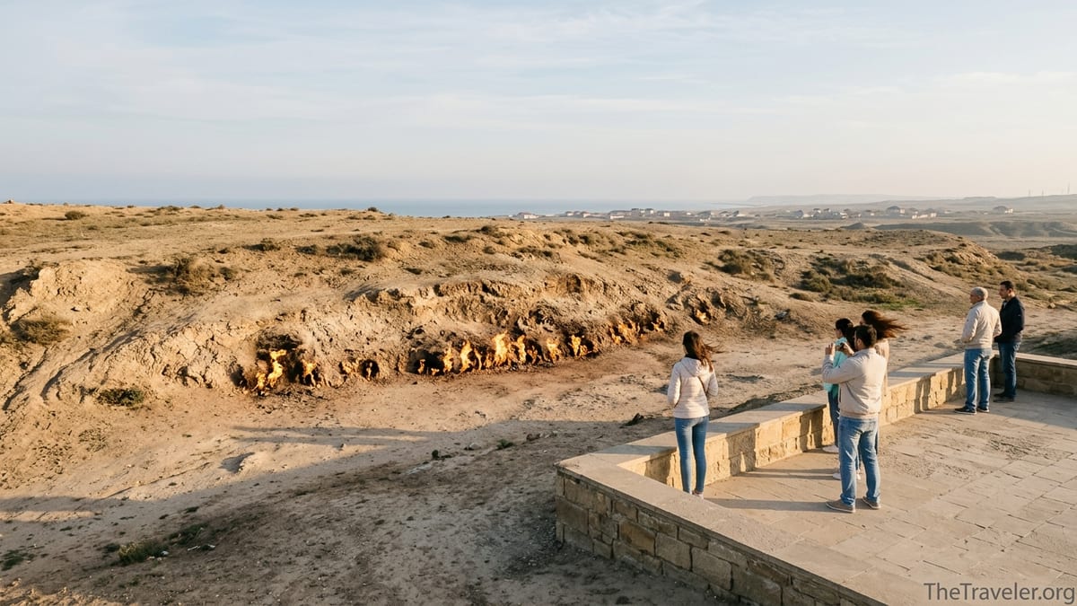 Visitors watching the natural gas flames of Yanar Dag on Azerbaijan’s Absheron Peninsula at sunset.