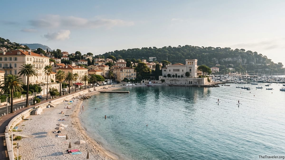 Morning view of Beaulieu sur Mer beach and bay with Belle Epoque buildings and calm turquoise water.