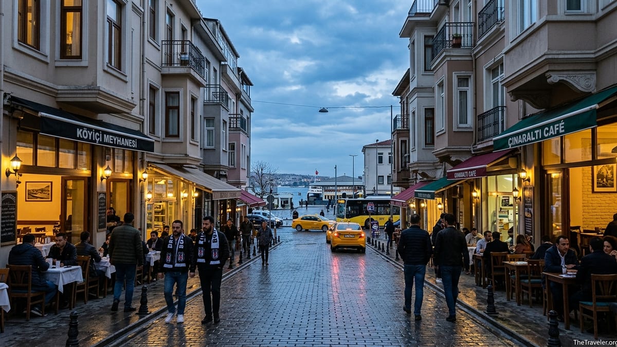 Early evening street scene in Beşiktaş with cafés, pedestrians and Bosphorus in the distance.