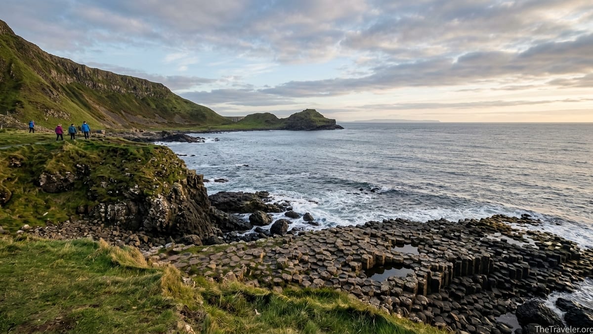 Golden-hour view of Northern Ireland’s Giant’s Causeway and cliffs along the Causeway Coast.