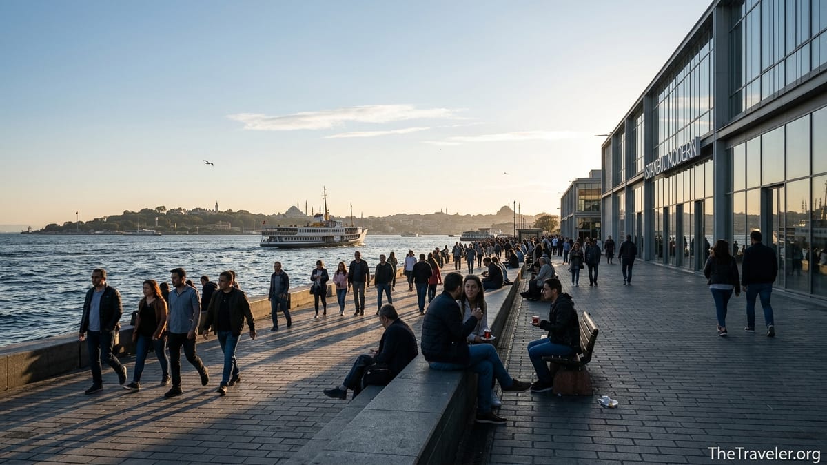 People walking along the Galataport promenade in Karaköy with a ferry and old city skyline at sunset.