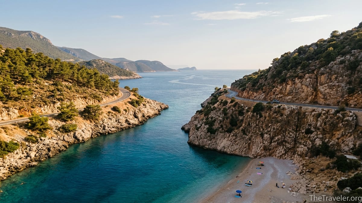Aerial view of Turkey’s Mediterranean coast with cliffs, clear turquoise sea and a winding coastal road.