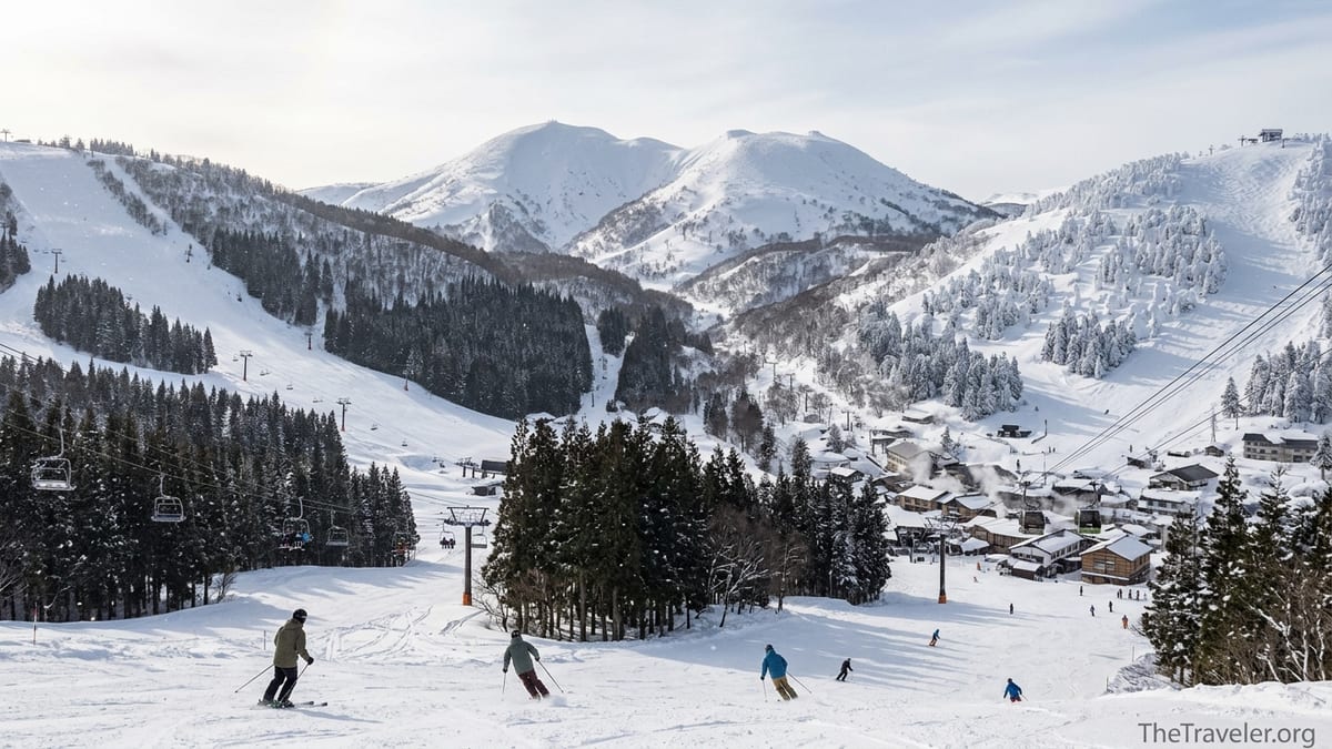 Panoramic winter view of Tohoku ski mountains showing Appi Kogen groomers, Hakkoda backcountry and Zao’s snow monsters above,
