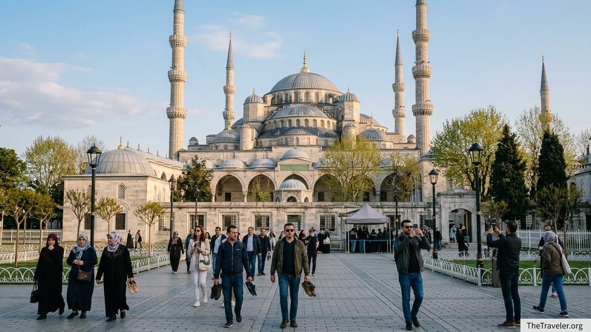 Visitors walking across Sultanahmet Square toward Istanbul’s Blue Mosque on a clear spring afternoon.