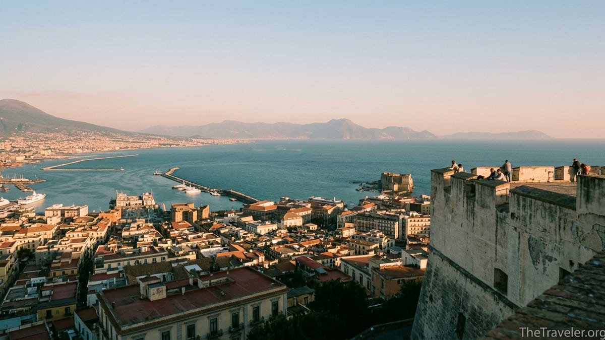 View from Castel Sant’Elmo over Naples toward Castel dell’Ovo and the Bay of Naples at sunset.