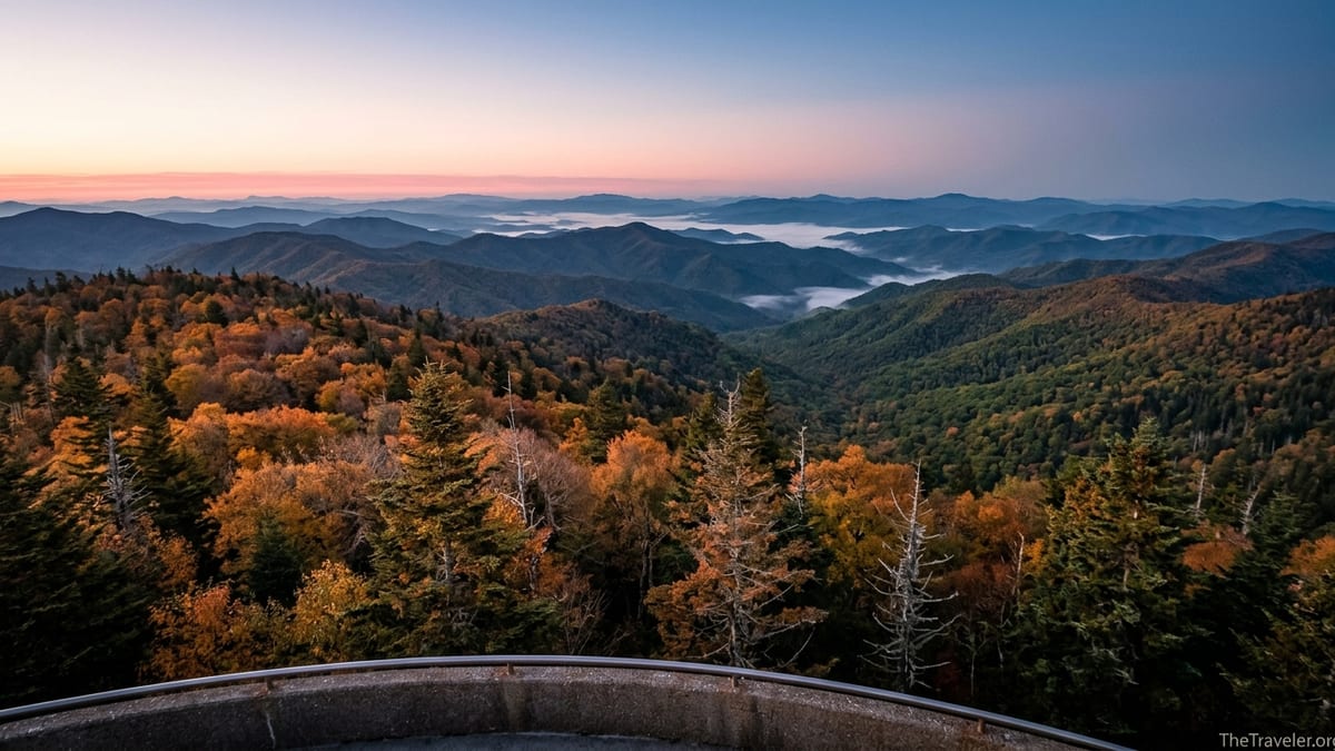Fall sunrise over layered Smoky Mountain ridges from Clingmans Dome observation tower.