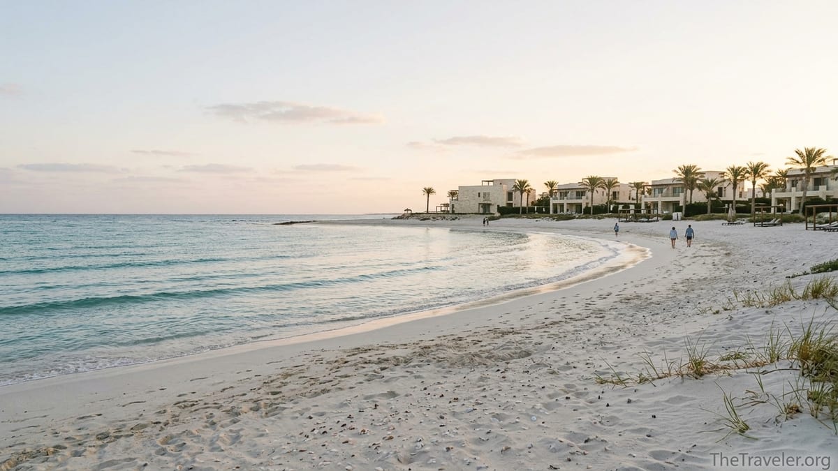 Sunrise over Ras El Hekma bay with turquoise water, white sand and low rise beach villas on Egypt’s North Coast.