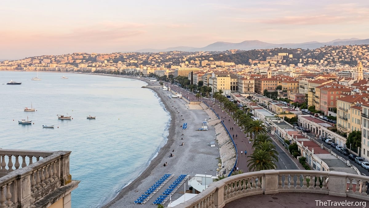 Sunrise over Nice and the French Riviera coastline with promenade and beach.