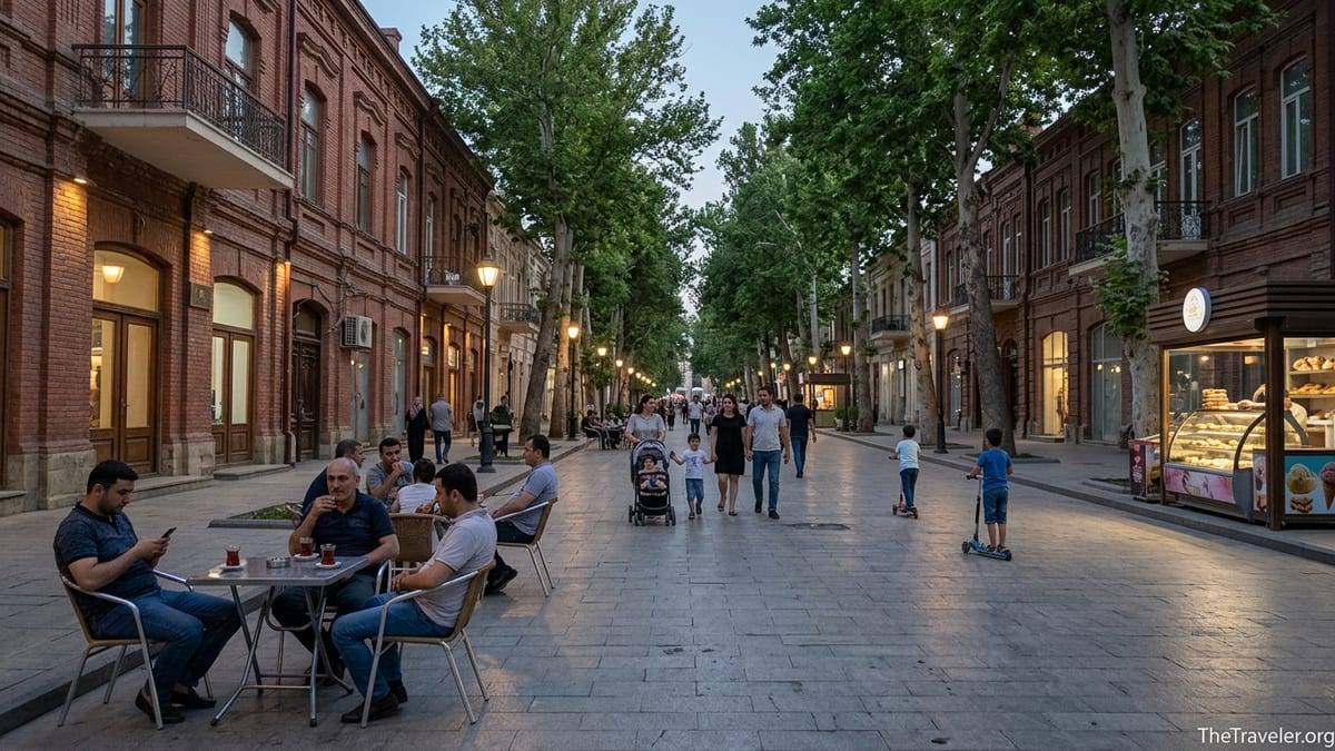 Early evening pedestrians and cafe tables on relaxed Javad Khan Street in Ganja, Azerbaijan.