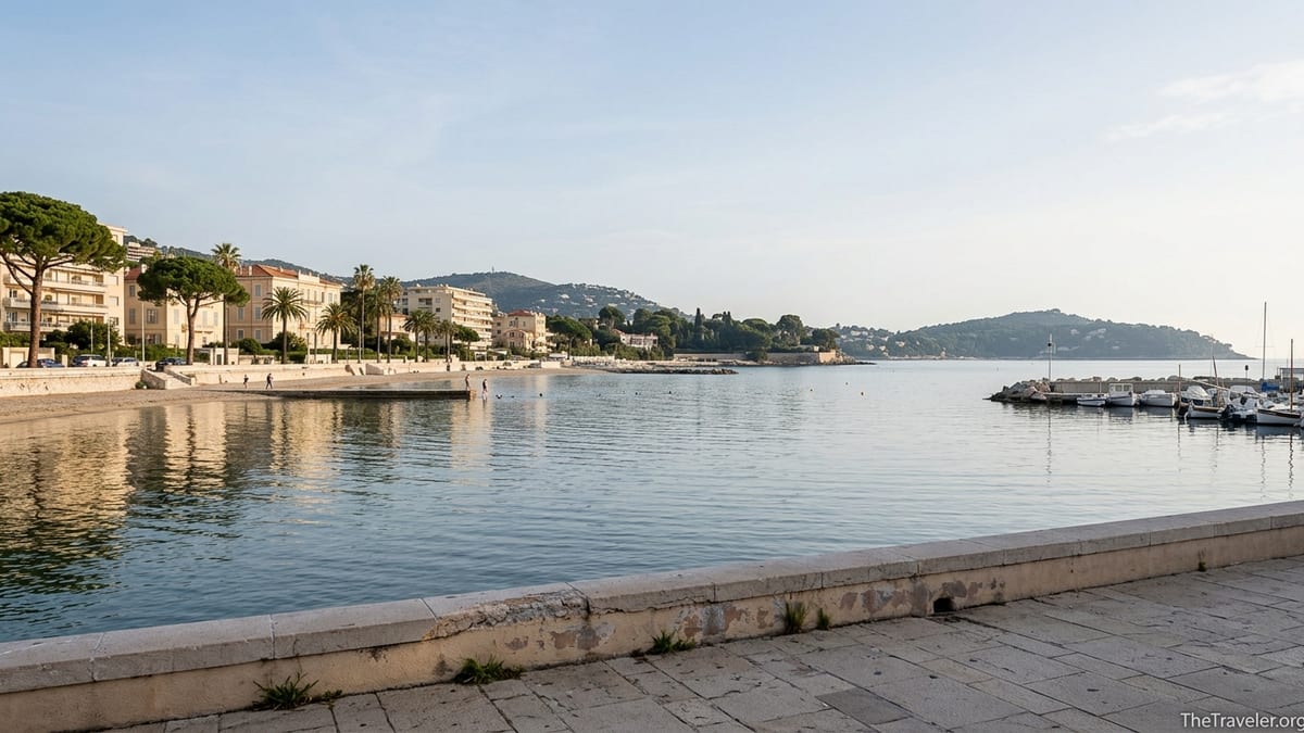 Sunrise over Beaulieu-sur-Mer with quiet beach, port and Belle Époque buildings.