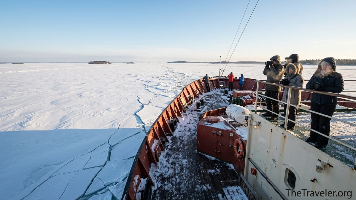 Passengers on Icebreaker Sampo watching the ship crush sea ice near Kemi, Finland.