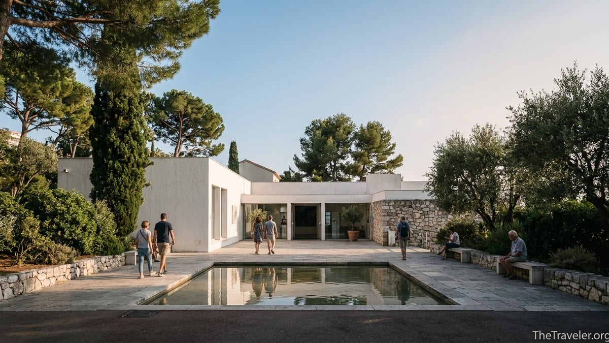 Courtyard of the Marc Chagall National Museum in Nice with visitors by a reflective pool.
