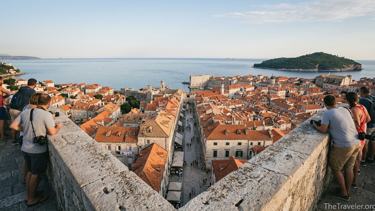 View over Dubrovnik’s old town rooftops and sea from the top of Minčeta Tower at sunset.