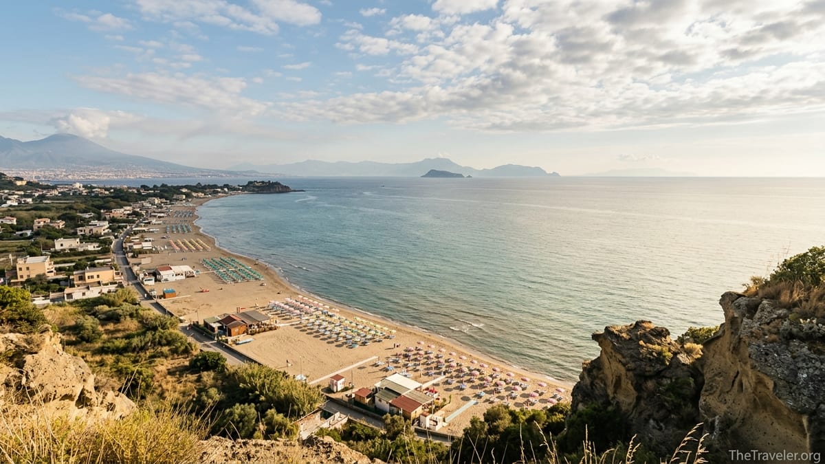 Aerial-style view of Miseno’s sandy beach and Gulf of Naples from Capo Miseno headland.
