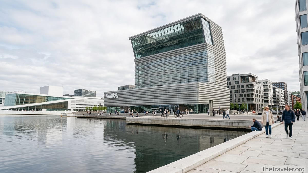 MUNCH museum on Oslo’s waterfront with visitors walking along the fjord promenade.