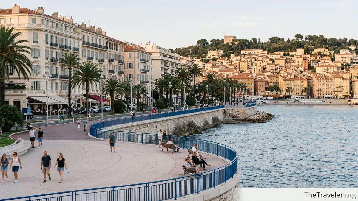 Promenade des Anglais in Nice with Carré d’Or facades and Old Town rising in the background.
