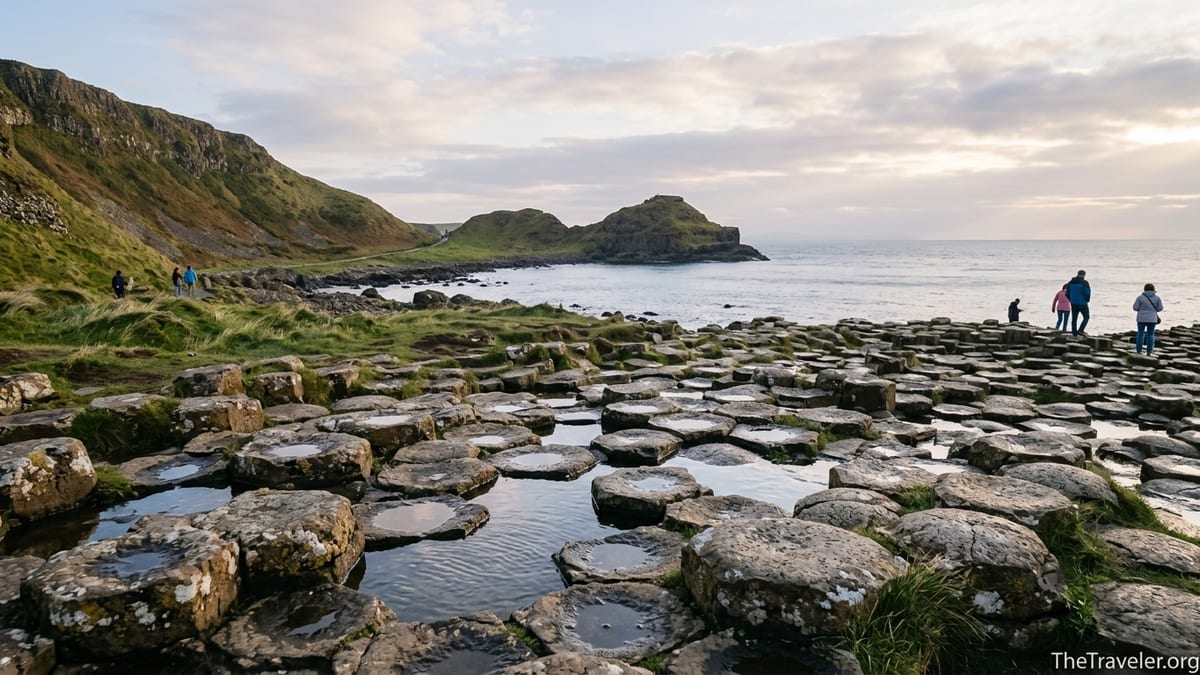Evening light over the Giant’s Causeway basalt columns and rugged Northern Ireland coast.