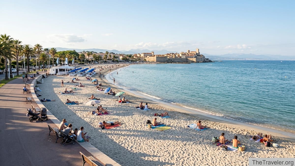 Late afternoon view of Plage du Ponteil in Antibes with calm turquoise water and sandy beach.