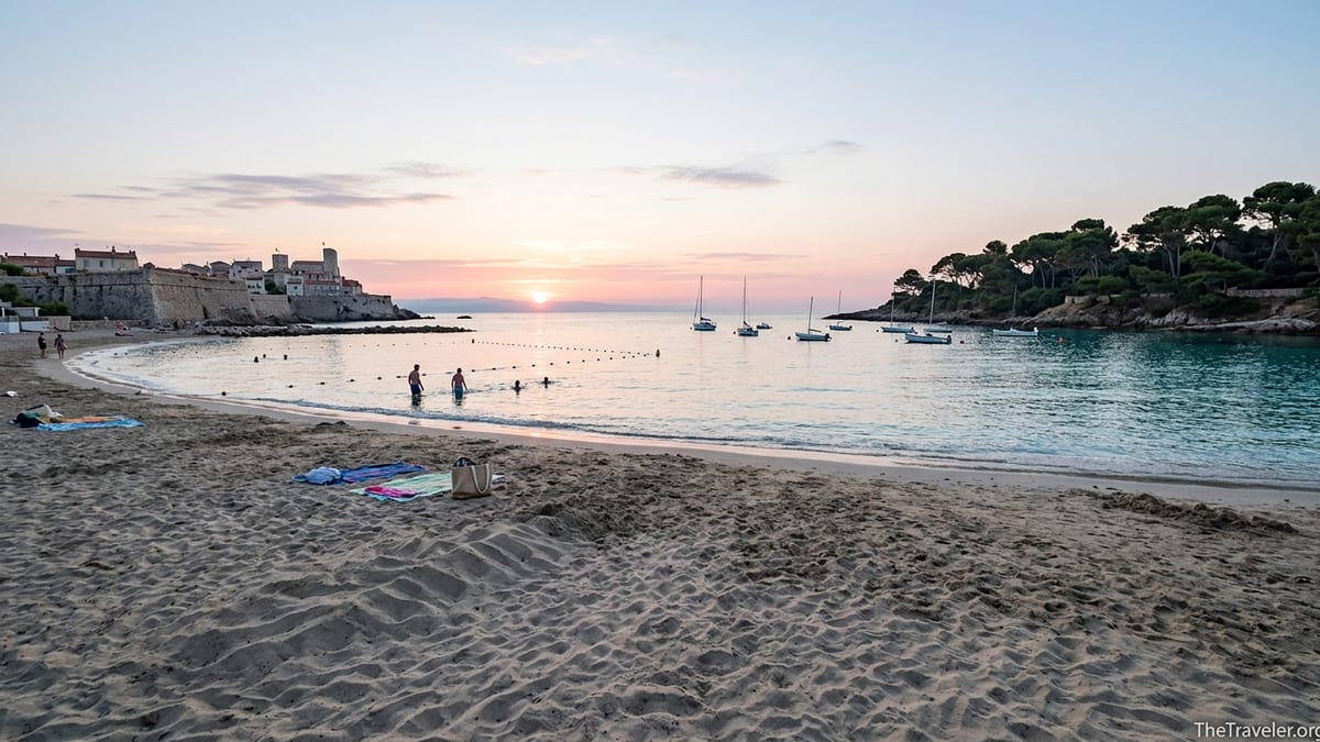 Early morning view along Plage du Ponteil in Antibes with swimmers, boats and Cap d’Antibes in soft light.