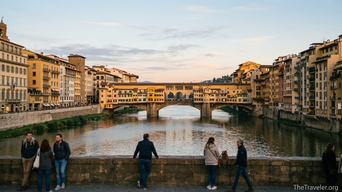 View of Ponte Vecchio and the Arno River at sunset, seen from Ponte alle Grazie in Florence.