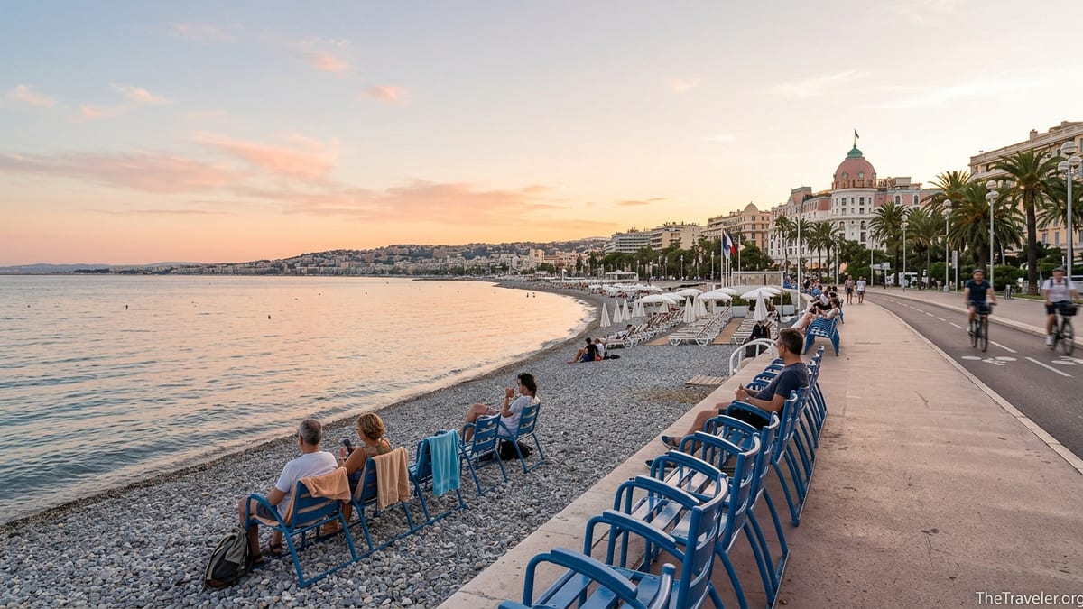 Golden hour view along Nice’s Promenade des Anglais with blue chairs, bike lane and pebble beach by the sea.