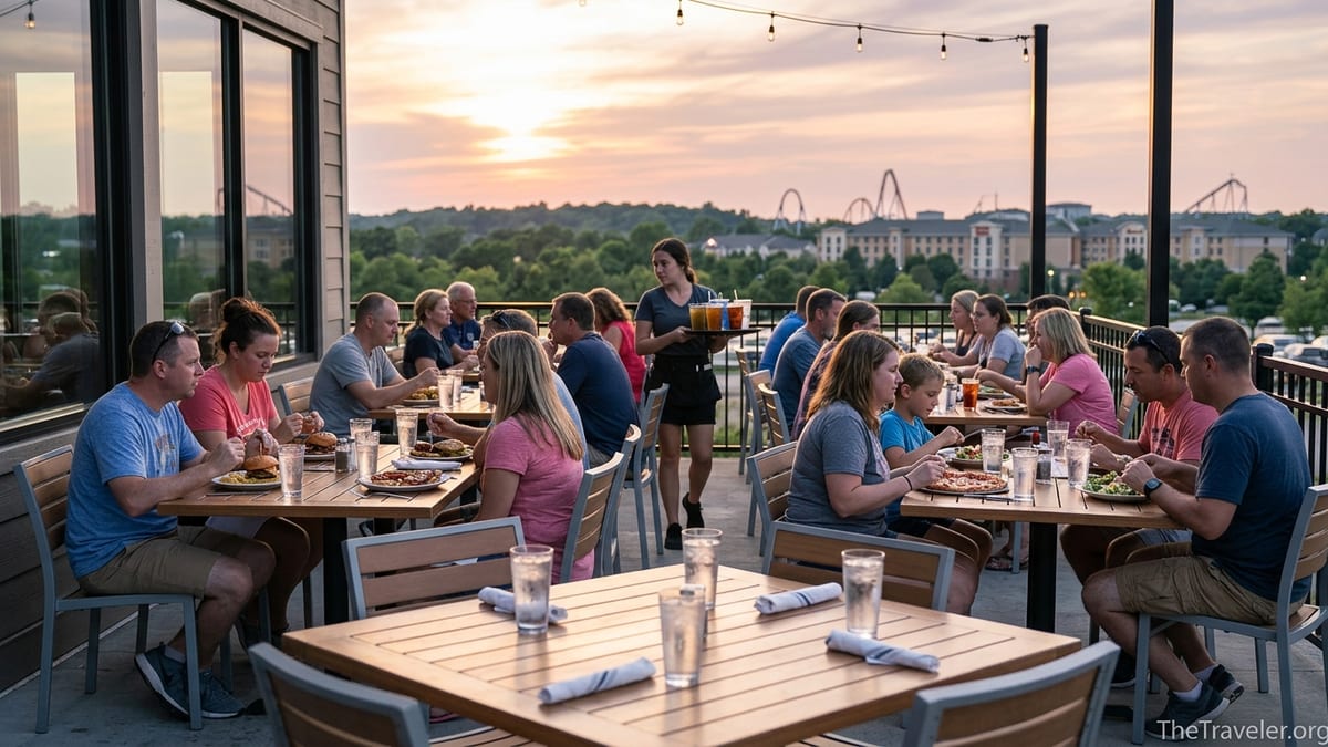 Outdoor restaurant patio near Kings Island at sunset with diners enjoying casual meals.