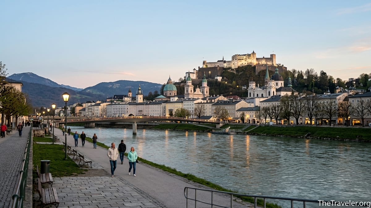 Evening view of Salzburg Old Town and Hohensalzburg Fortress from the Salzach riverside.