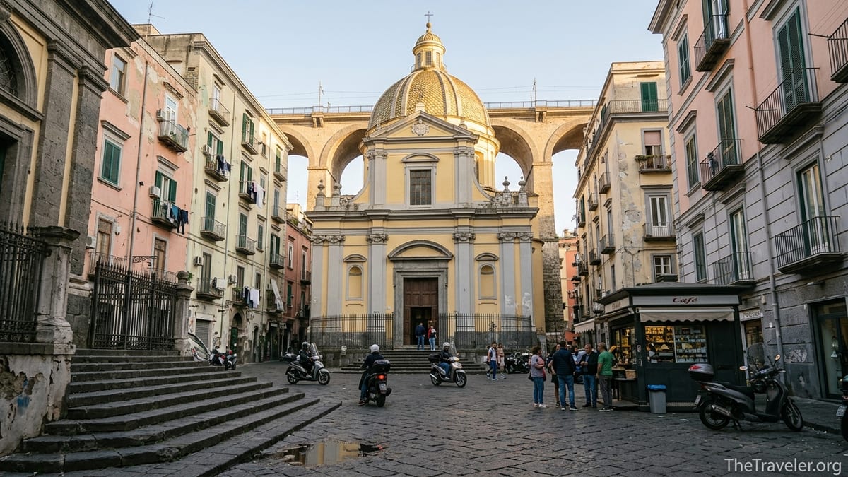 Santa Maria della Sanità basilica with yellow dome overlooking a busy piazza in Naples’ Rione Sanità.