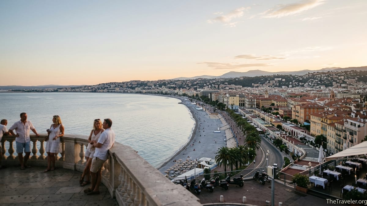 Evening view over Nice’s Baie des Anges with Promenade des Anglais and terracotta-roofed old town.