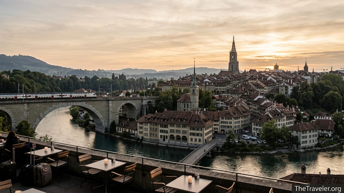Bern old town and Aare River at golden hour with train crossing bridge on the Swiss Plateau.