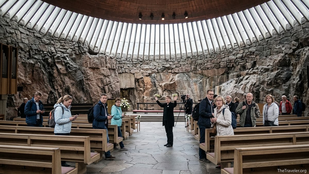 Visitors being ushered out of Helsinki’s rock-hewn Temppeliaukio Church under its copper dome.