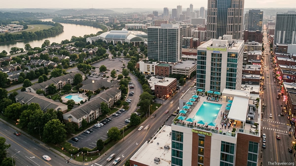 Aerial view contrasting Nashville’s Opryland resort area with downtown Margaritaville rooftop pool and Broadway skyline at at