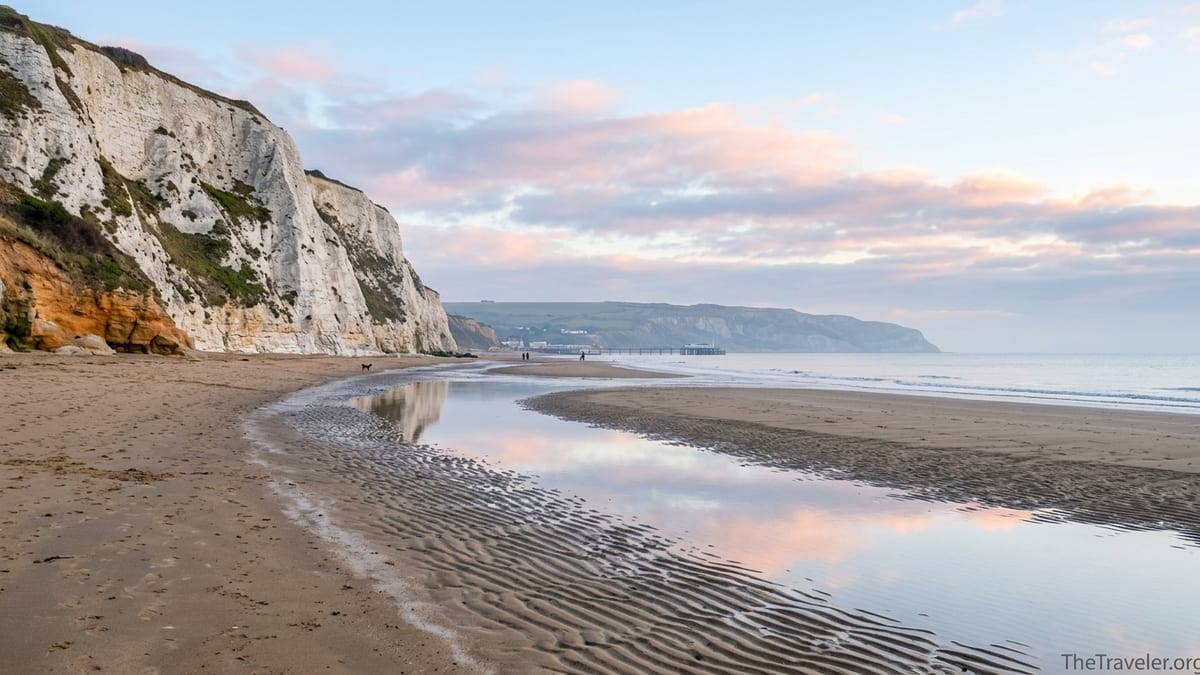 Sunrise over Yaverland Beach and Culver Down with Sandown Bay curving into the distance.